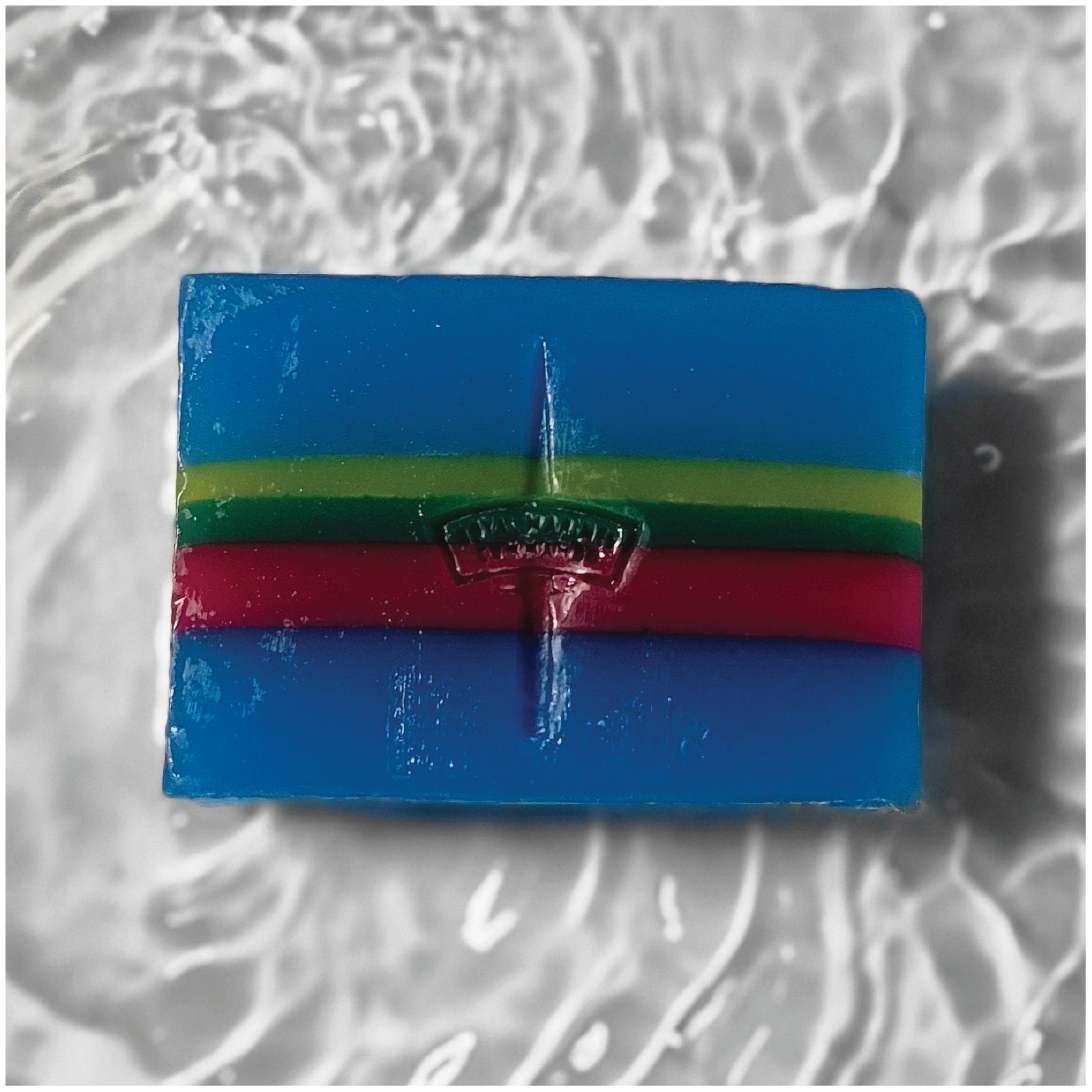 Royal marine coloured soap bar sat on a  bed of water and stamped with a royal marine logo
