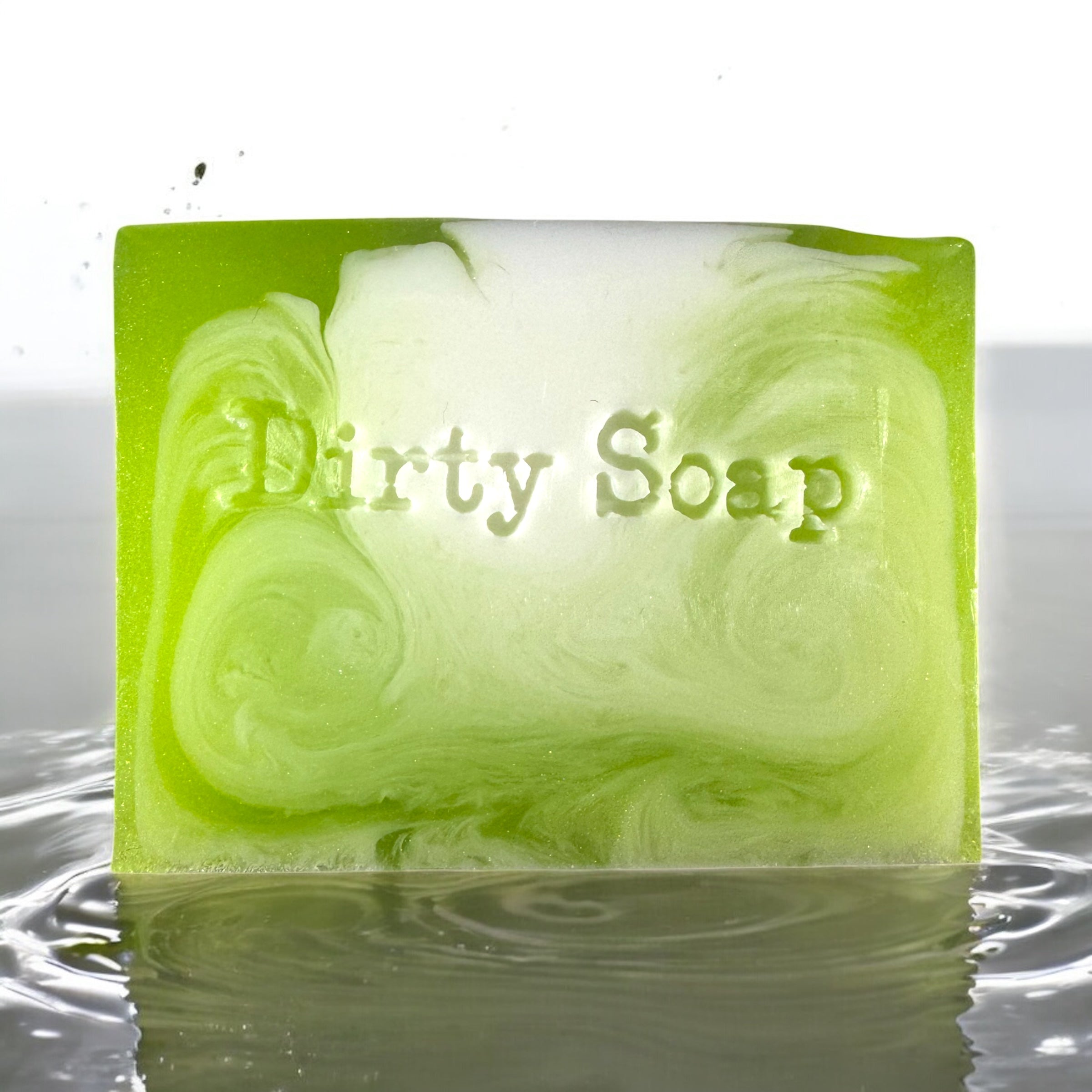 green and white soap bar sat in a puddle of water