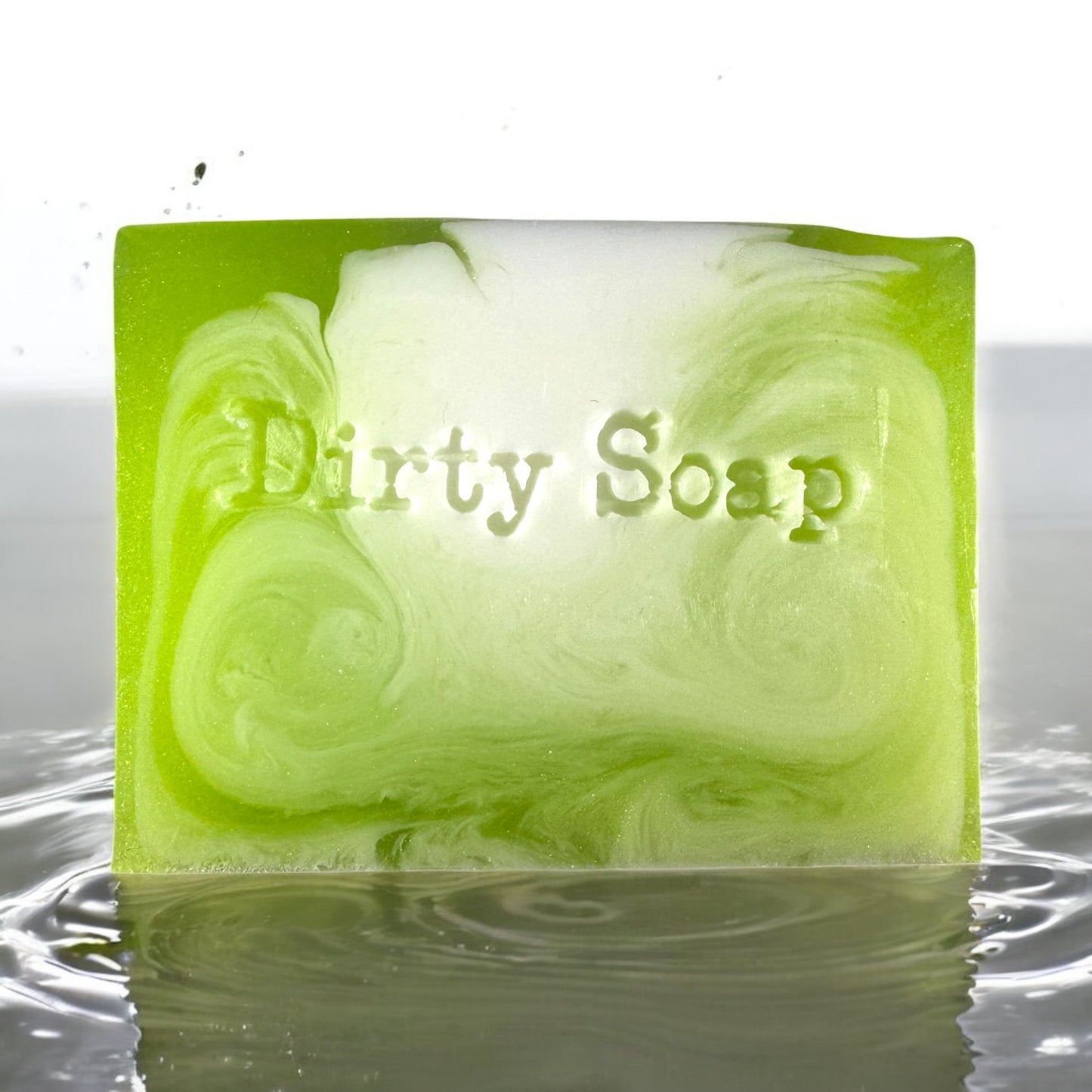green and white soap bar sat in a puddle of water