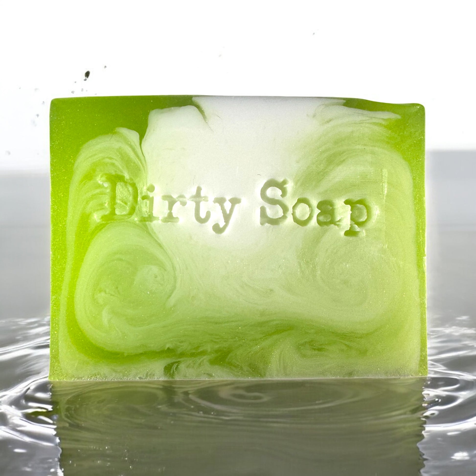 green and white soap bar sat in a puddle of water